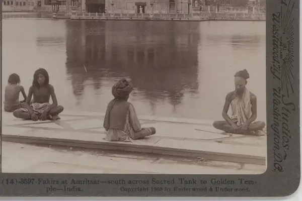 "Fakirs" meditating on the bank of the temple tank in the Golden Temple complex in Amritsa